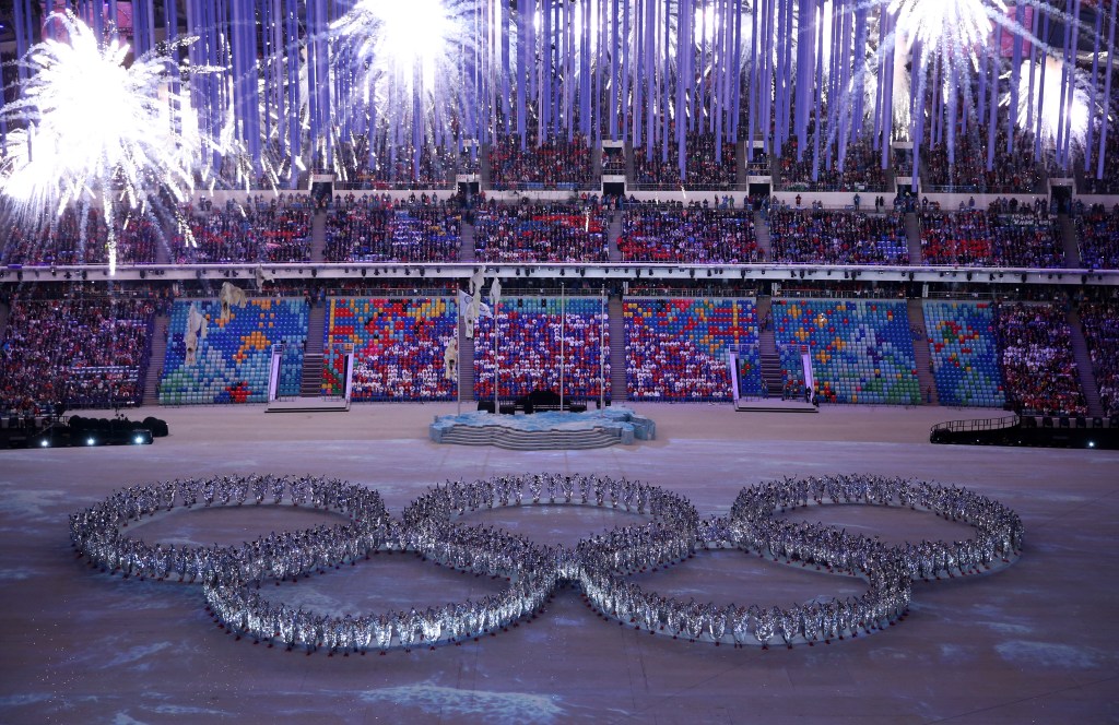   Dancers form the Olympic rings during the 2014 Sochi Winter Olympics Closing Ceremony at Fisht Olympic Stadium on February 23, 2014 in Sochi, Russia.  (Photo by Matthew Stockman/Getty Images)