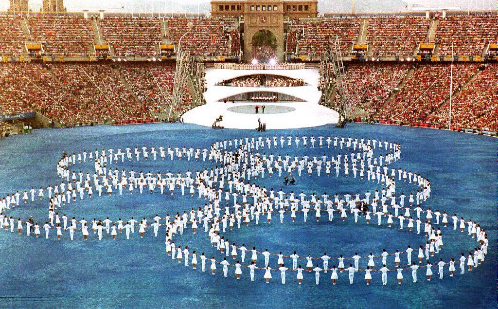   The Olympic rings are set on the pitch during the opening ceremony of the XXVth Summer Olympics 25 July 1992 at Montjuic Stadium. Approximately 12,000 athletes, officials and coaches from 170 countries are participating in the games. (Photo credit should read MICHEL GANGNE/AFP via Getty Images)