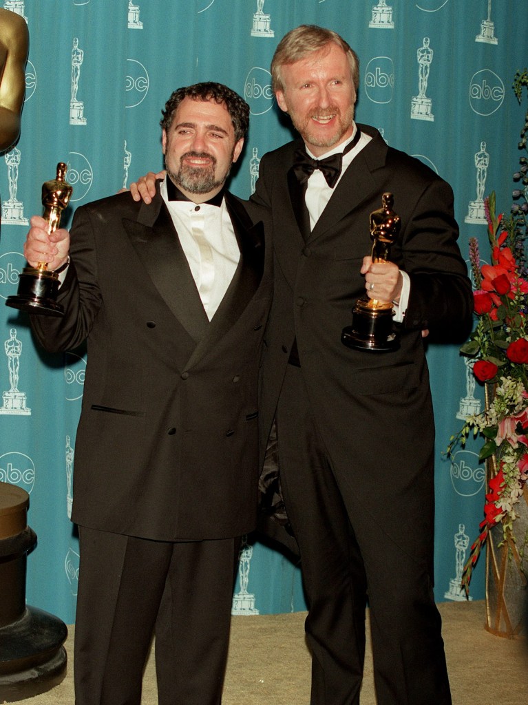 (Original Caption) Producer Jon Landau & director James Cameron with the Oscar for Best Picture for 'Titanic'. (Photo by Frank Trapper/Corbis via Getty Images)