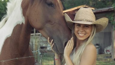 Haliey Welch posing with horse.