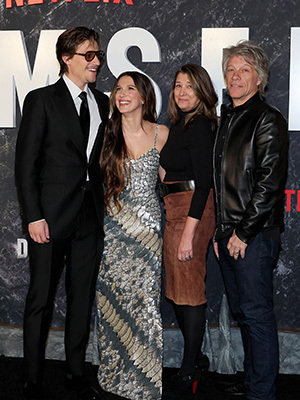 Millie Bobby Brown alongside Jake Bongiovi, Jon Bon Jovi, and Dorothea Hurley at event.