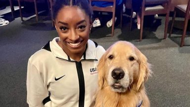 simone biles and beacon miller therapy dog at olympics