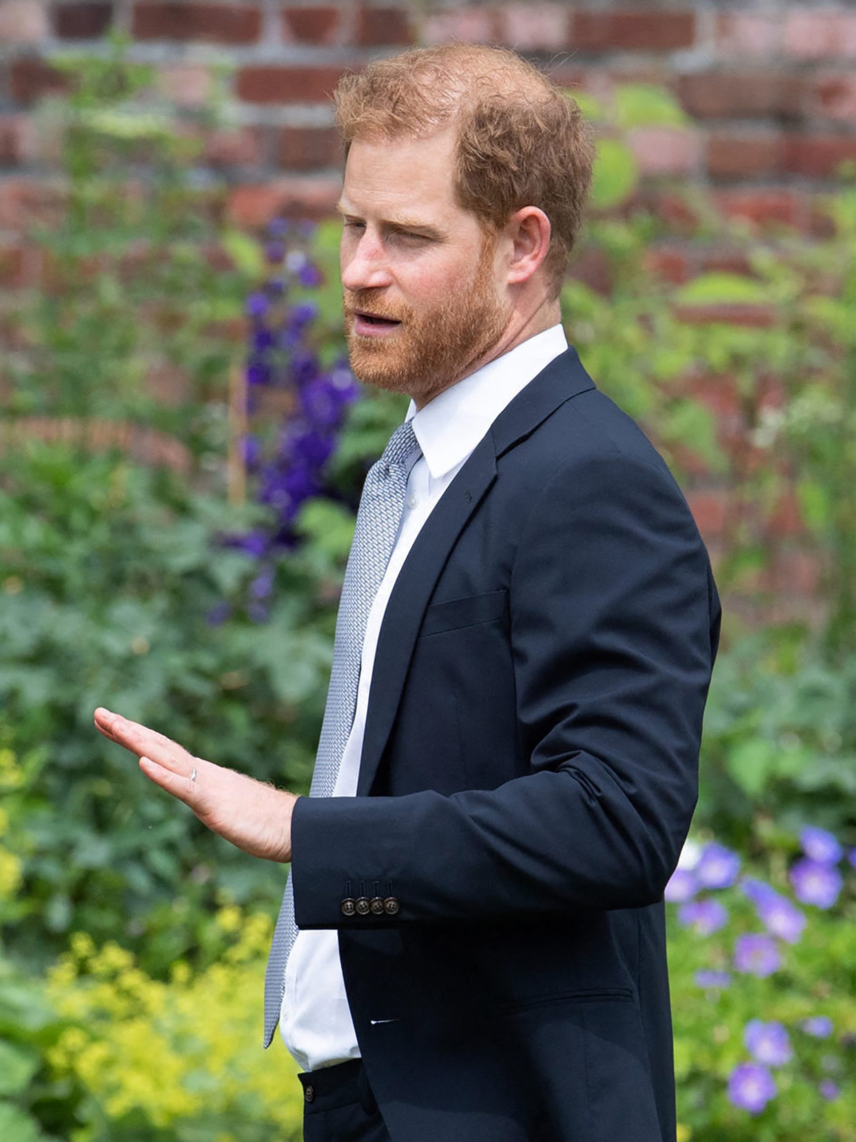 TOPSHOT - Britain's Prince Harry, Duke of Sussex (L) and Britain's Prince William, Duke of Cambridge attend the unveiling of a statue of their mother, Princess Diana at The Sunken Garden in Kensington Palace, London on July 1, 2021, which would have been her 60th birthday. Princes William and Harry set aside their differences on Thursday to unveil a new statue of their mother, Princess Diana, on what would have been her 60th birthday. (Photo by Dominic Lipinski / POOL / AFP) (Photo by DOMINIC LIPINSKI/POOL/AFP via Getty Images)
