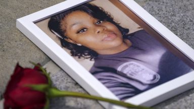 WASHINGTON, DC - JULY 30: A photo of Breonna Taylor is seen among other photos of women who have lost their lives as a result of violence during the 2nd Annual Defend Black Women March in Black Lives Matter Plaza on July 30, 2022 in Washington, DC. (Photo by Leigh Vogel/Getty Images for Frontline Action Hub)