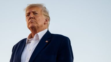 Donald Trump looks on during a rally at the Waco Regional Airport