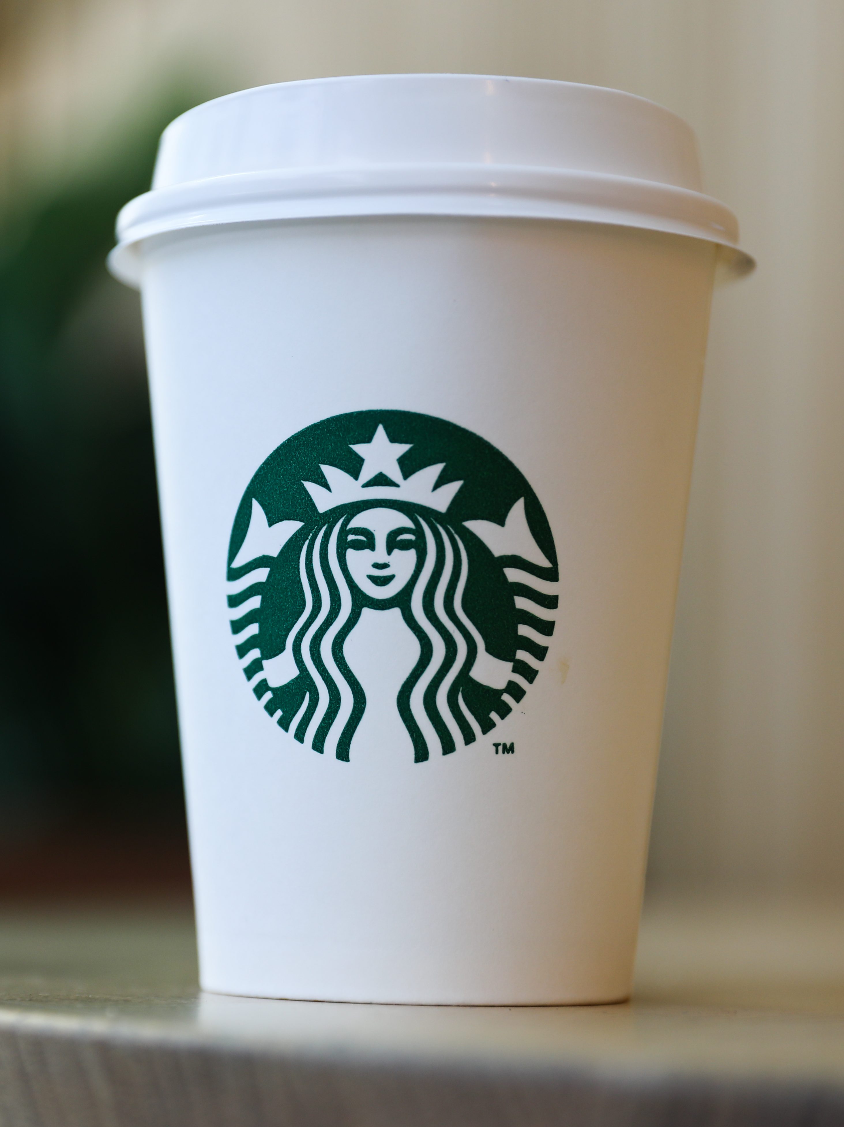 Starbucks Coffee cup is seen in this illustration photo taken at the cafe in Manama, Bahrain on March 5, 2024. (Photo by Jakub Porzycki/NurPhoto via Getty Images)