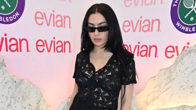 LONDON, ENGLAND - JULY 11: Charli XCX poses in the evian 'Mountain Of Youth' VIP suite during day 11 of Wimbledon 2024 on July 11, 2024 in London, England. (Photo by Dave Benett/Getty Images for evian)