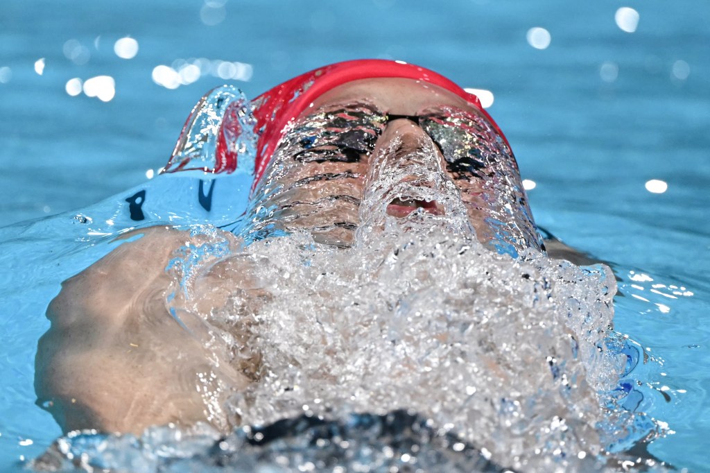 Britain's Luke Greenbank competes in a heat of the men's 200m backstroke swimming event during the Paris 2024 Olympic Games at the Paris La Defense Arena in Nanterre, west of Paris, on July 31, 2024. (Photo by Jonathan NACKSTRAND / AFP) (Photo by JONATHAN NACKSTRAND/AFP via Getty Images)