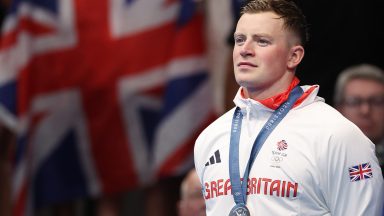 NANTERRE, FRANCE - JULY 28: Adam Peaty of Team Great Britain is seen on the podium with his silver medal from the Men's 100m Breaststroke final on day two of the Olympic Games Paris 2024 at Paris La Defense Arena on July 28, 2024 in Nanterre, France. (Photo by Ian MacNicol/Getty Images)