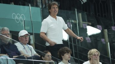 PARIS, FRANCE - JULY 28: Tom Cruise attends day two of the Paris 2024 Olympic Games at the artistic gymnastics event with Simone Biles of USA at Paris Arena on July 28, 2024 in Paris, France. (Photo by Jean Catuffe/Getty Images)