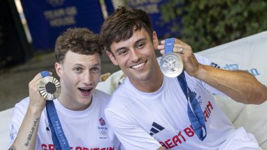 PARIS, FRANCE - JULY 29: Tom Daley (R) and Noah Williams of Team GB show off their silver medals after finishing second in 10m synchronised Platform at Olympic Games Paris 2024 at Team GB House on July 29, 2024 in Paris, France. (Photo by Matt Greaves/Team GB via Getty Images)