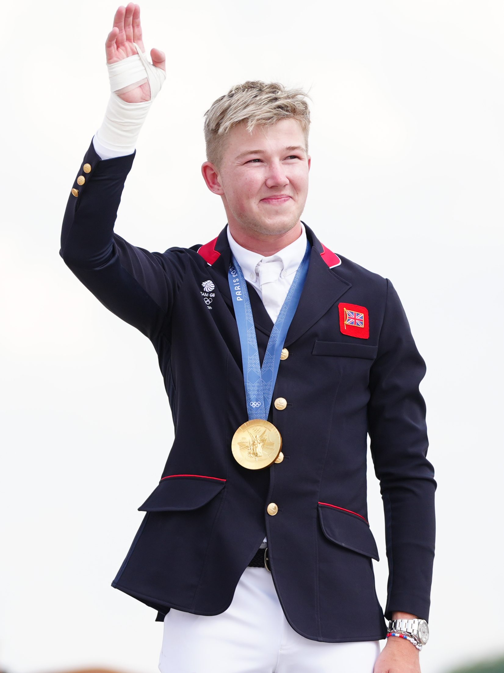 Great Britain's Harry Charles celebrates with their gold medal during the ceremony of the Jumping Team Final at the Chateau de Versailles on the seventh day of the 2024 Paris Olympic Games in France. Picture date: Friday August 2, 2024. (Photo by David Davies/PA Images via Getty Images)