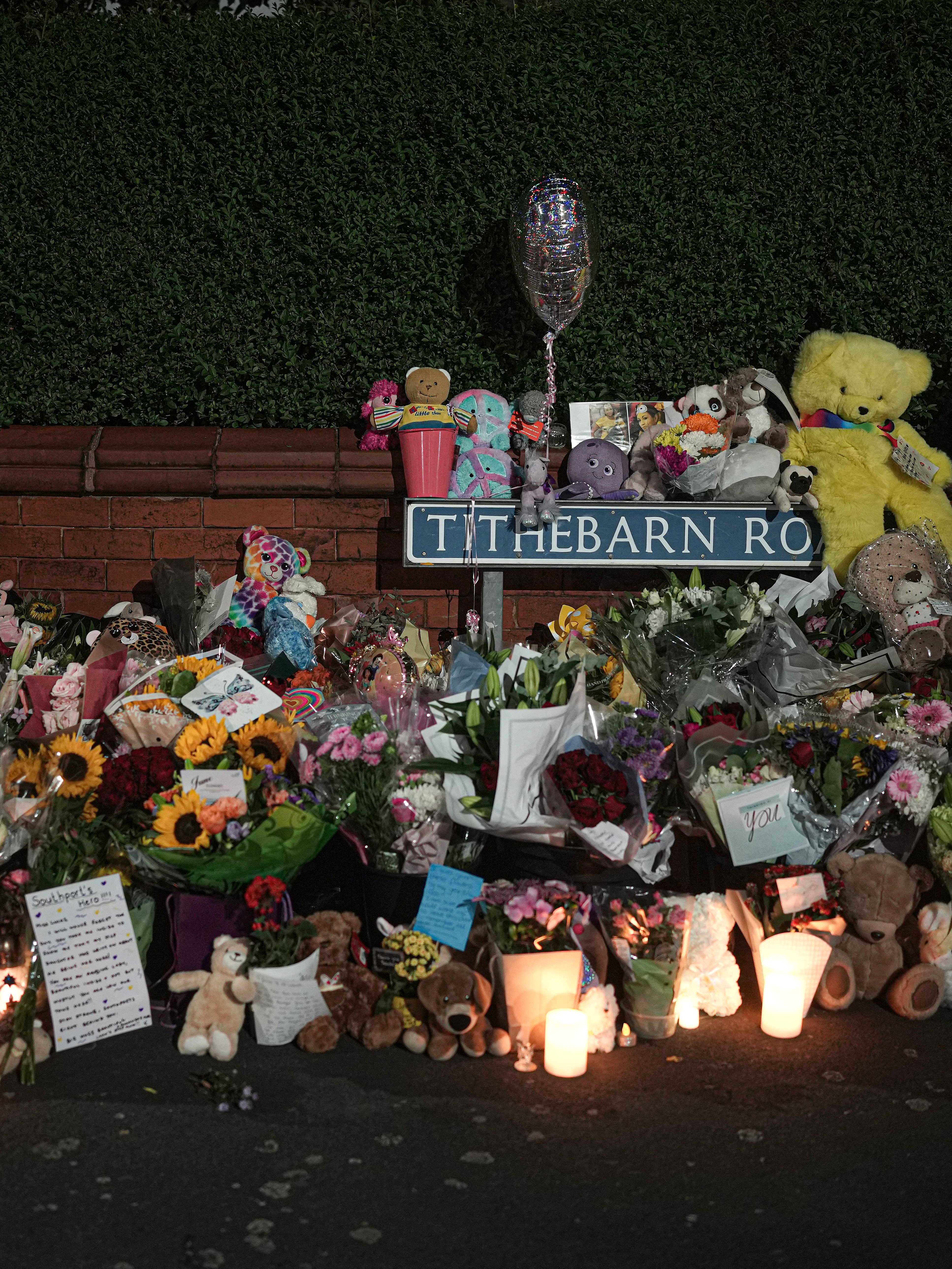 SOUTHPORT, ENGLAND - JULY 30: Tributes and candles to the victims of the Southport knife attack continue to be laid near the scene on July 30, 2024 in Southport, England. A teenager armed with a knife attacked children at a Taylor Swift-themed holiday club in Hart Lane, Southport yesterday morning. Three children have died and five children and two adults remain in a critical condition in hospital. A 17-year-old boy has been arrested.  (Photo by Christopher Furlong/Getty Images)