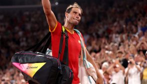 PARIS, FRANCE - JULY 31: Rafael Nadal of Team Spain acknowledges the crowd as he leaves the court with partner (out of frame) Carlos Alcaraz of Team Spain after their Men's Doubles Quarter-final match against Austin Krajicek of Team United States and Rajeev Ram of Team United States on day five of the Olympic Games Paris 2024 at Roland Garros on July 31, 2024 in Paris, France. (Photo by Julian Finney/Getty Images)