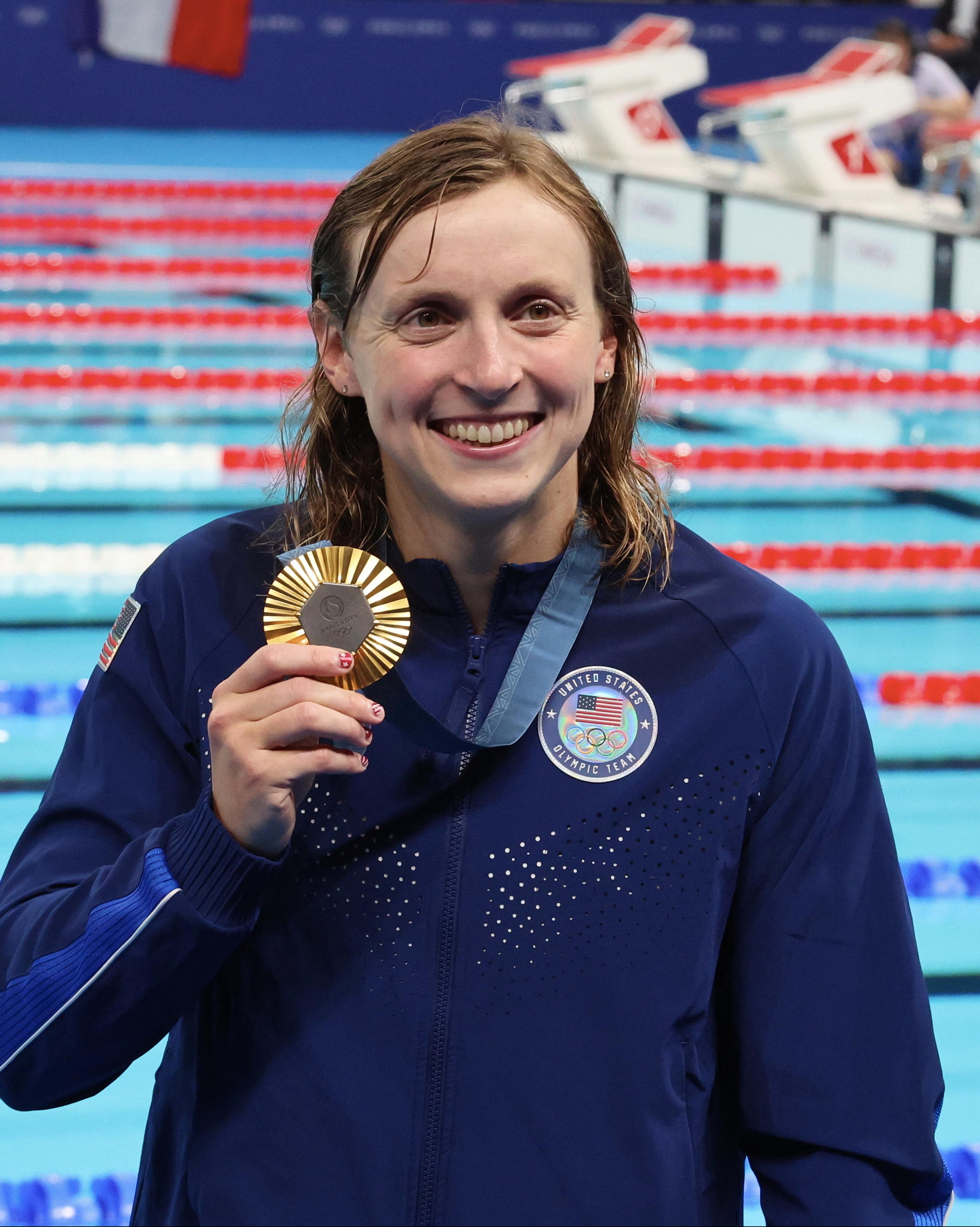Katie Ledecky of Team United States poses with her Gold medal