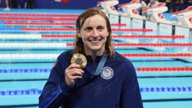 Katie Ledecky of Team United States poses with her Gold medal