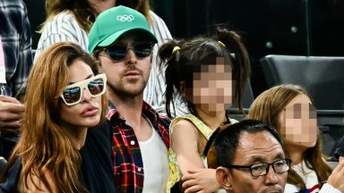 Eva Mendes and Ryan Gosling attend the artistic gymnastics women's uneven bars final during the Paris 2024 Olympic Games