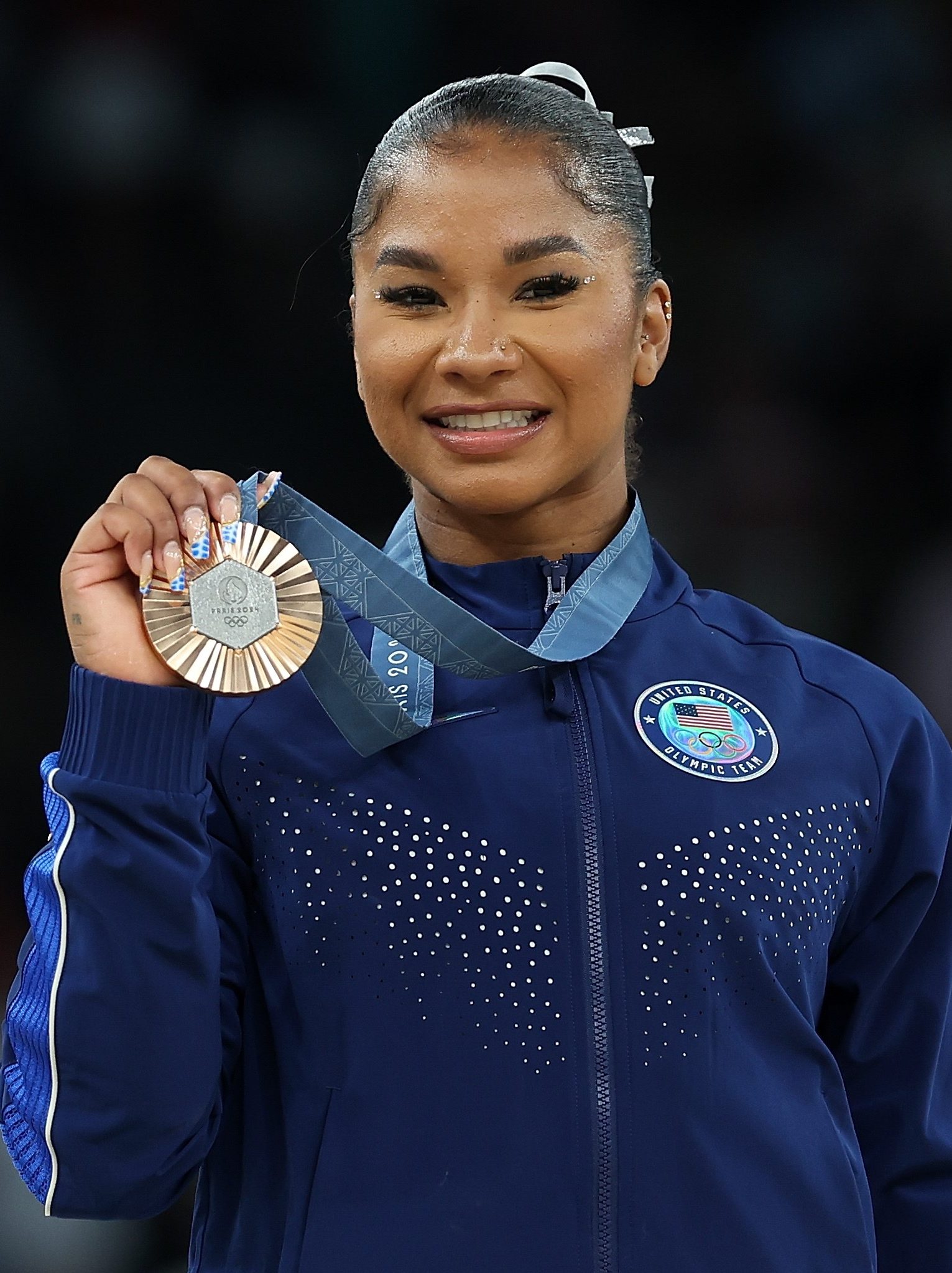 Bronze medalist Jordan Chiles of the United States poses for photos during the victory ceremony of women's floor exercise of artistic gymnastics at the Paris 2024 Olympic Games in Paris, France, Aug. 5, 2024. (Photo by Cao Can/Xinhua via Getty Images)