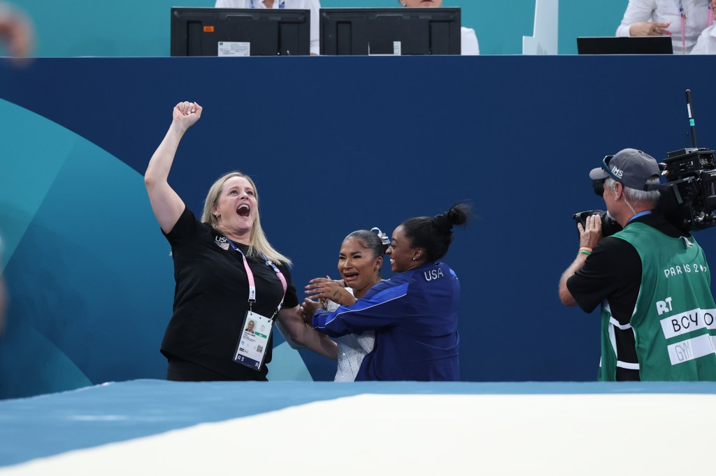 Gymnastics: 2024 Summer Olympics: Team USA with silver medalist Simone Biles, coach Cécile Quentin-Kanquetou-Landy and bronze medalist Jordan Chiles win the women's floor exercise final at the Bercy Arena, Paris, France, August 5, 2024, Credit: Simone Burti (Photo by Simone Burti/Sports Illustrated via Getty Images) (Set Number: X164574 TK1)