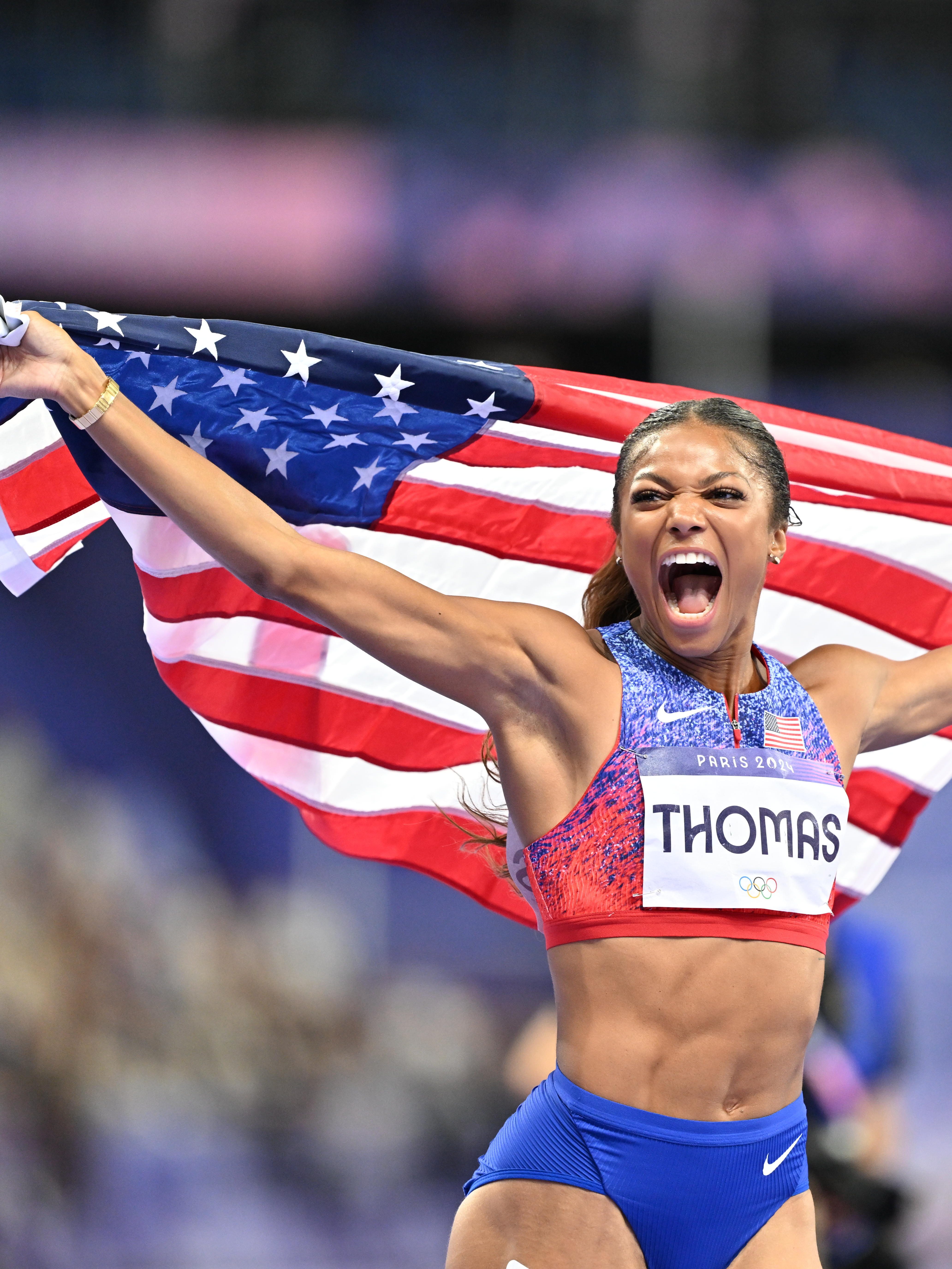 PARIS, FRANCE - AUGUST 06: Gold medalist Gabrielle Thomas of Team United States celebrates after winning the Women's 200m Final on day eleven of the Olympic Games Paris 2024 at Stade de France on August 06, 2024 in Paris, France (Photo by Mustafa Yalcin/Anadolu via Getty Images)