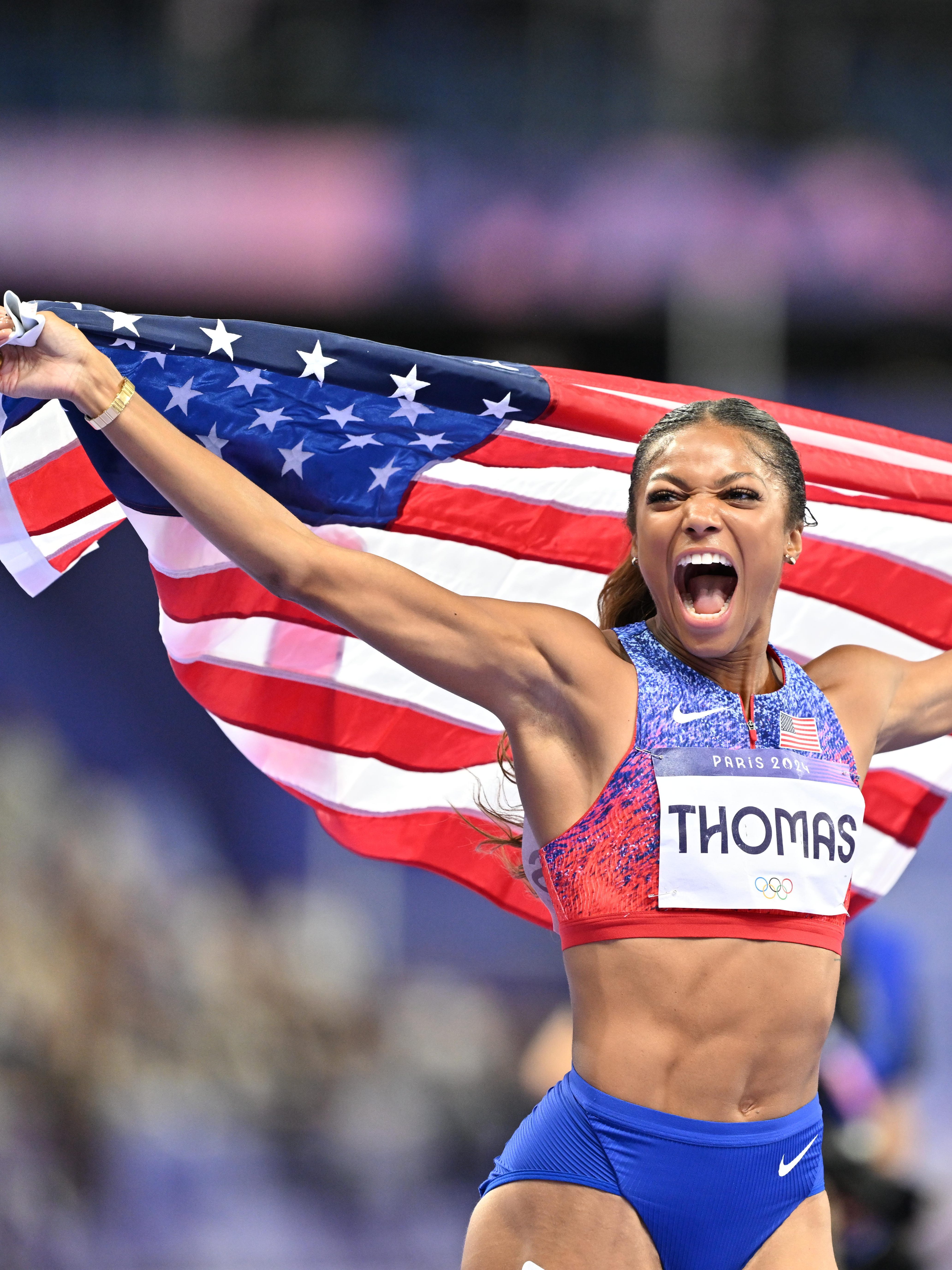 PARIS, FRANCE - AUGUST 06: Gold medalist Gabrielle Thomas of Team United States celebrates after winning the Women's 200m Final on day eleven of the Olympic Games Paris 2024 at Stade de France on August 06, 2024 in Paris, France (Photo by Mustafa Yalcin/Anadolu via Getty Images)