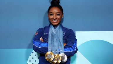 PARIS, FRANCE - AUGUST 05: Simone Biles of Team United States poses with her Paris 2024 Olympic medals following the Artistic Gymnastics Women's Floor Exercise Final on day ten of the Olympic Games Paris 2024 at Bercy Arena on August 05, 2024 in Paris, France. (Photo by Jamie Squire/Getty Images)