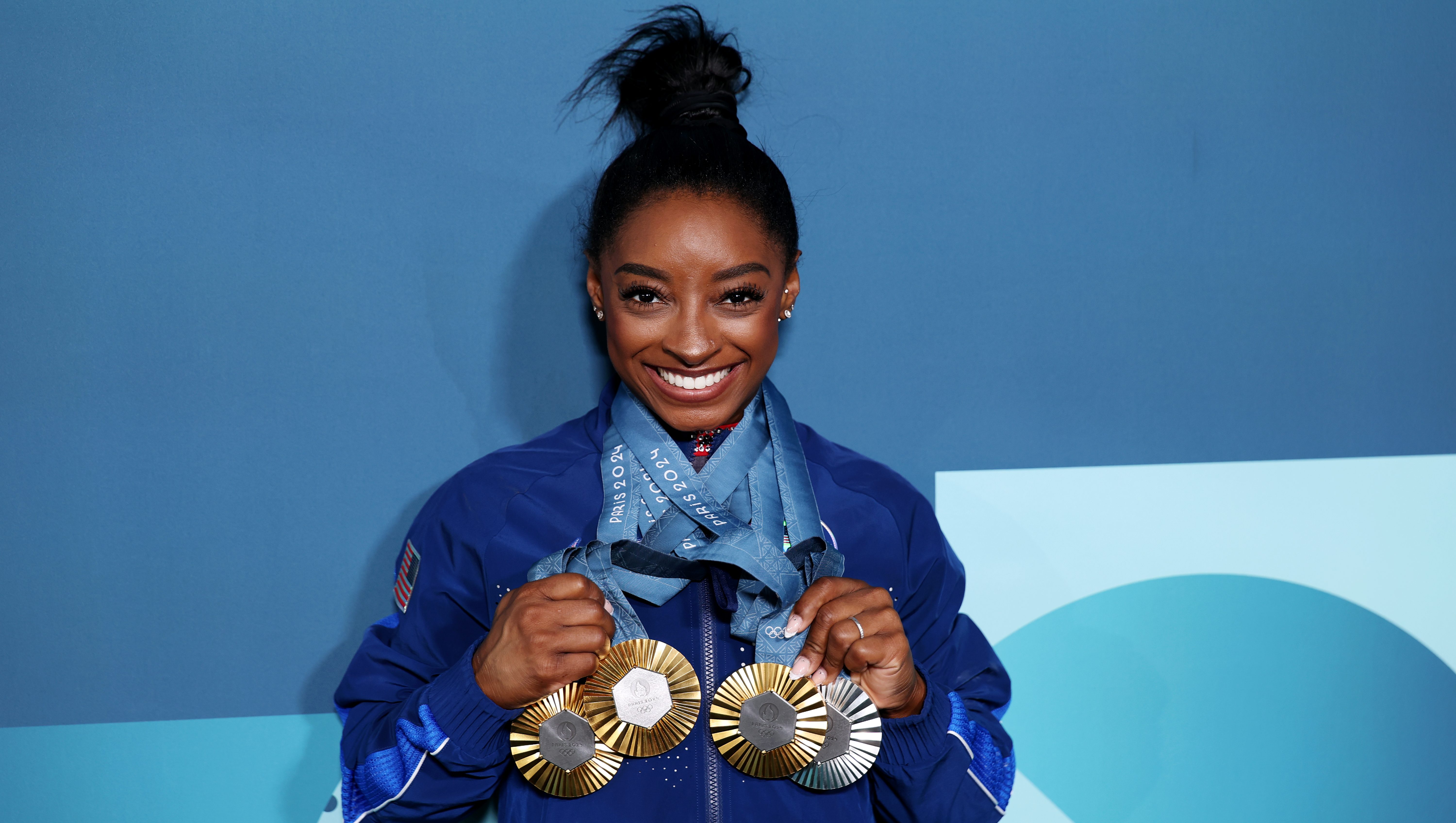 Simone Biles Poses in Front of All Her Olympic Medals