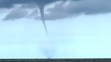 08 August 2024, Lower Saxony, Borkum: The photo taken by a fishing boat shows a suspected tornado off the North Sea island of Borkum. A suspected tornado has caused minor devastation on the beach of the North Sea island of Borkum. On Thursday, the tornado moved from the sea over a section of the west beach and on to the promenade, as can be seen in videos on the internet. Photo: Rolf Groenewold/dpa (Photo by Rolf Groenewold/picture alliance via Getty Images)