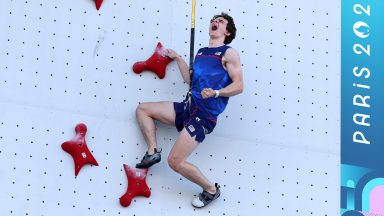 PARIS, FRANCE - AUGUST 06: Sam Watson of Team United States celebrates after setting a new world record of 4.75 seconds during the Men's Speed, Qualification Seeding on day eleven of the Olympic Games Paris 2024 at Le Bourget Sport Climbing Venue on August 06, 2024 in Paris, France. (Photo by Al Bello/Getty Images)