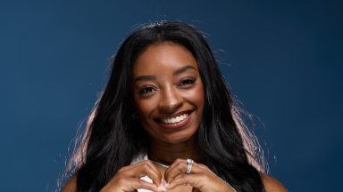 Simone Biles poses for a photo at the USA House at Paris