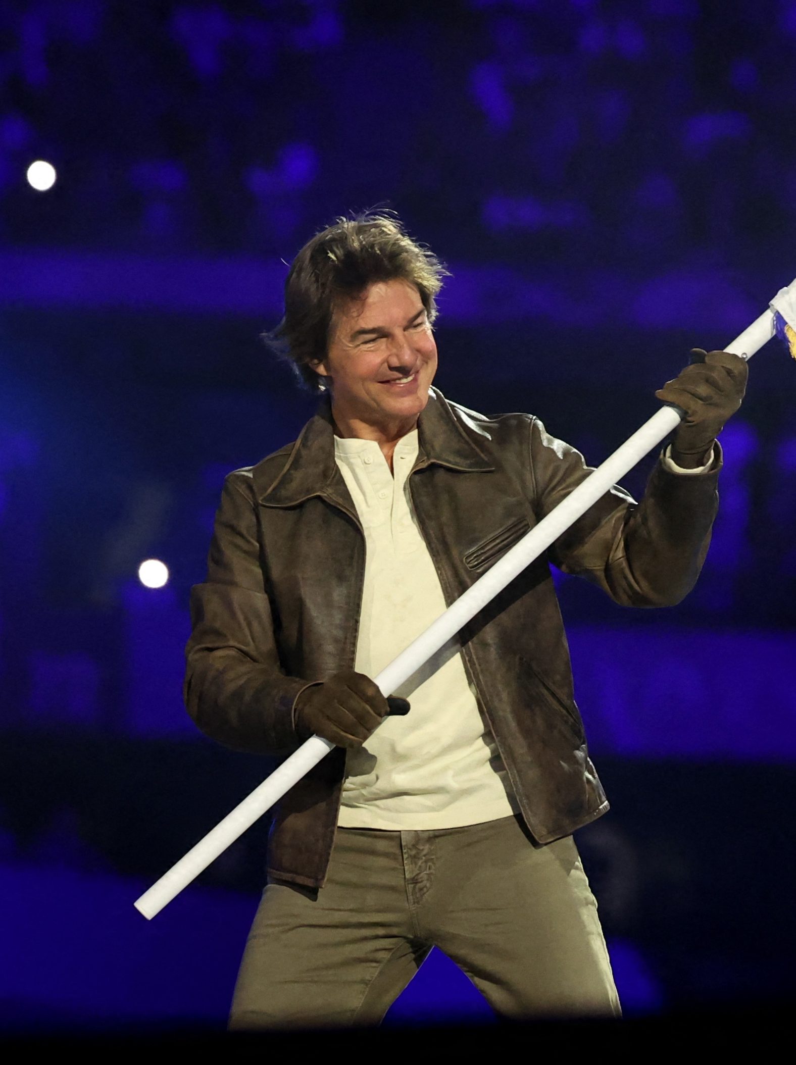 Tom Cruise holds the Olympic flag during the Closing Ceremony of the Olympic Games Paris 2024 at Stade de France