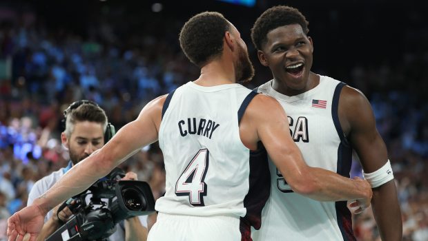 PARIS, FRANCE - AUGUST 08: Stephen Curry #4 and Anthony Edwards #5 of Team United States celebrate during a Men's basketball semifinals match between Team United States and Team Serbia on day thirteen of the Olympic Games Paris 2024 at Bercy Arena on August 08, 2024 in Paris, France. (Photo by Gregory Shamus/Getty Images)