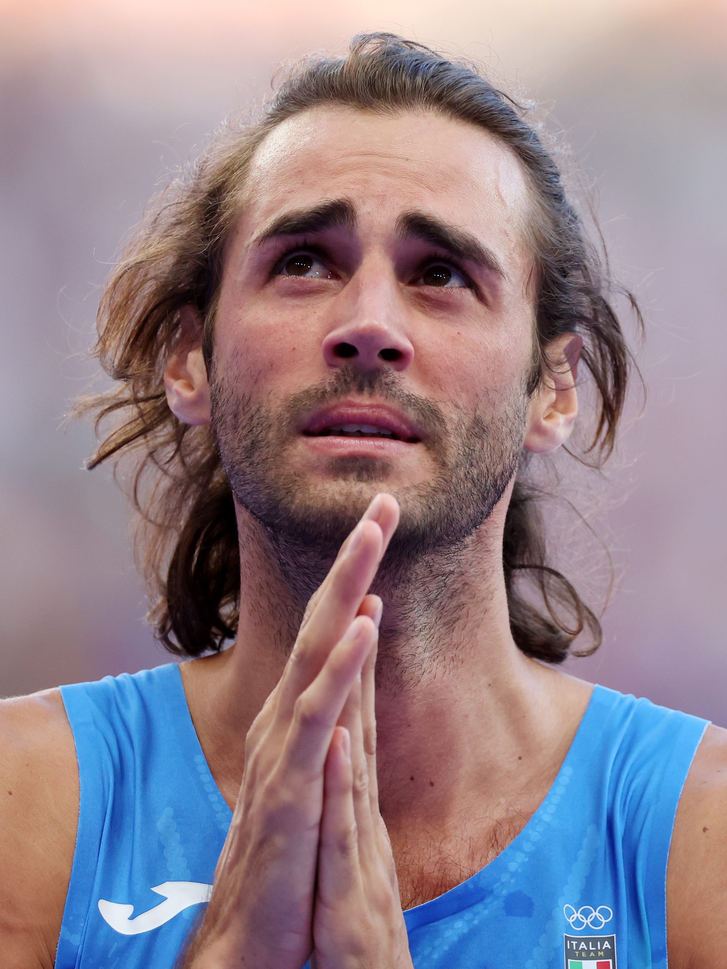 PARIS, FRANCE - AUGUST 10: Gianmarco Tamberi of Team Italy shows his dejection after competing in the Men's High Jump Final on day fifteen of the Olympic Games Paris 2024 at Stade de France on August 10, 2024 in Paris, France. (Photo by Al Bello/Getty Images)