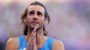 PARIS, FRANCE - AUGUST 10: Gianmarco Tamberi of Team Italy shows his dejection after competing in the Men's High Jump Final on day fifteen of the Olympic Games Paris 2024 at Stade de France on August 10, 2024 in Paris, France. (Photo by Al Bello/Getty Images)