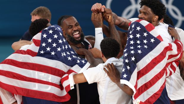 PARIS, FRANCE - AUGUST 10: LeBron James #6 of Team United States celebrates with teammates after their victory against Team France during the Men's Gold Medal game between Team France and Team United States on day fifteen of the Olympic Games Paris 2024 at Bercy Arena on August 10, 2024 in Paris, France. (Photo by Jamie Squire/Getty Images)