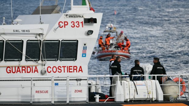 Italian Coast Guards carry a body on a rescue boat in Porticello harbor near Palermo, with a third body at the back of the boat on August 21, 2024, two days after the British-flagged luxury yacht Bayesian sank. Divers searching for six missing people following the sinking of a superyacht off Sicily in a storm have found four bodies, a source close to the search told AFP. The Bayesian, which had 22 people aboard including 10 crew, was anchored some 700 metres from port before dawn when it was struck by a waterspout. Among the six missing were UK tech entrepreneur Mike Lynch and his 18-year-old daughter Hannah, and Jonathan Bloomer, the chair of Morgan Stanley International, and his wife Judy. (Photo by Alberto PIZZOLI / AFP) (Photo by ALBERTO PIZZOLI/AFP via Getty Images)