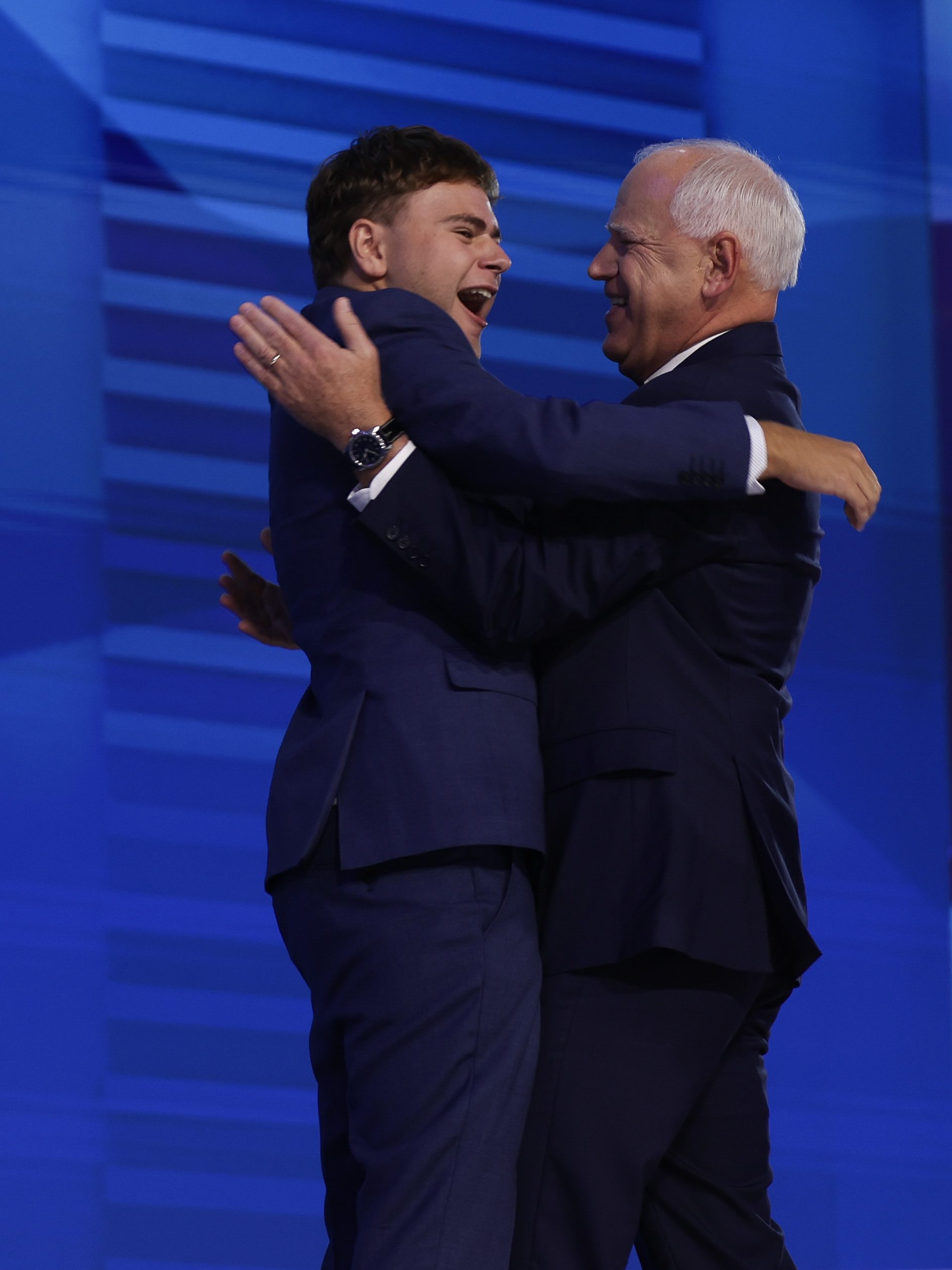 CHICAGO, ILLINOIS - AUGUST 21: Democratic vice presidential nominee Minnesota Gov. Tim Walz celebrates with his son Gus Walz (C-L), wife Gwen Walz (R) and daughter Hope Walz (L) after accepting the Democratic vice presidential nomination on stage during the third day of the Democratic National Convention at the United Center on August 21, 2024 in Chicago, Illinois. Delegates, politicians, and Democratic Party supporters are in Chicago for the convention, concluding with current Vice President Kamala Harris accepting her party's presidential nomination. The DNC takes place from August 19-22.   (Photo by Justin Sullivan/Getty Images)