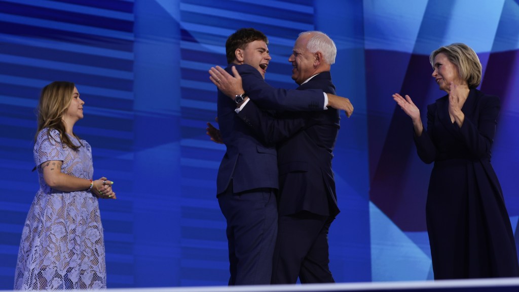 CHICAGO, IL - AUGUST 21: Democratic vice presidential nominee and Minnesota Governor Tim Walz celebrates with his son Gus Walz (L), wife Gwen Walz (R) and daughter Hope Walz (L) on stage as he accepts the Democratic vice presidential nomination on the third day of the Democratic National Convention at the United Center on August 21, 2024 in Chicago, Illinois. Delegates, politicians and Democratic supporters gather in Chicago for the convention, which will conclude with current Vice President Kamala Harris accepting the party's presidential nomination. The Democratic National Convention runs from August 19-22. (Photo by Justin Sullivan/Getty Images)