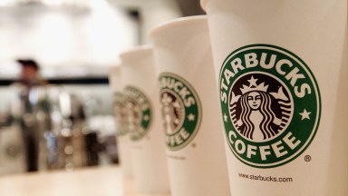 Beverage cups featuring the logo of Starbucks Coffee