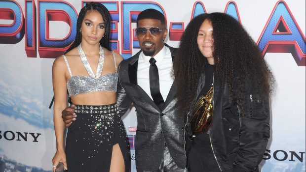 LOS ANGELES, CA - DECEMBER 13:   Corinne Foxx, Jamie Foxx and Annalise Foxx attend Sony Pictures' "Spider-Man: No Way Home" Los Angeles Premiere held at The Regency Village Theatre on December 13, 2021 in Los Angeles, California.  (Photo by Albert L. Ortega/Getty Images)