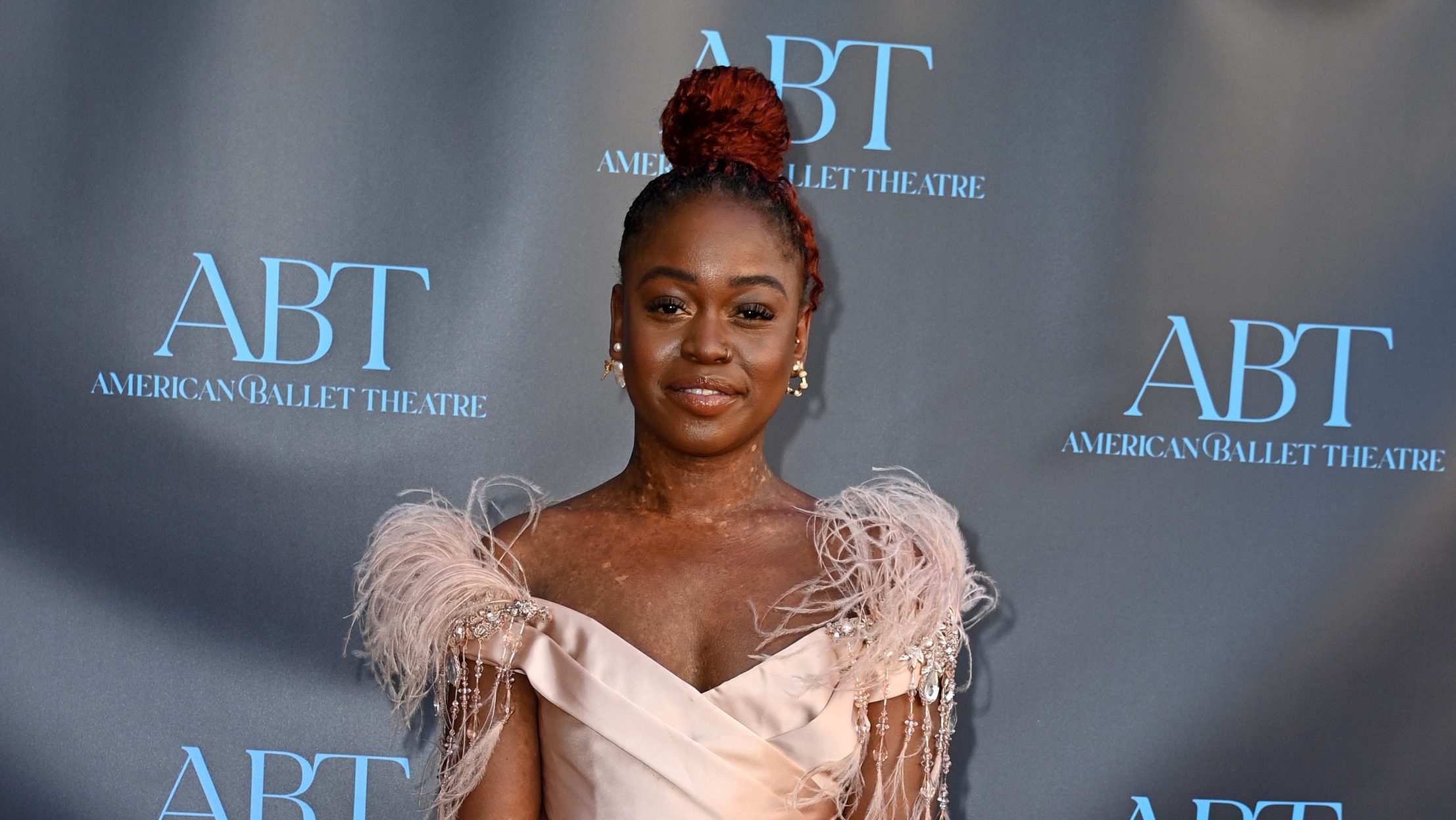 Michaela DePrince wearing a pink dress at the ABT gala