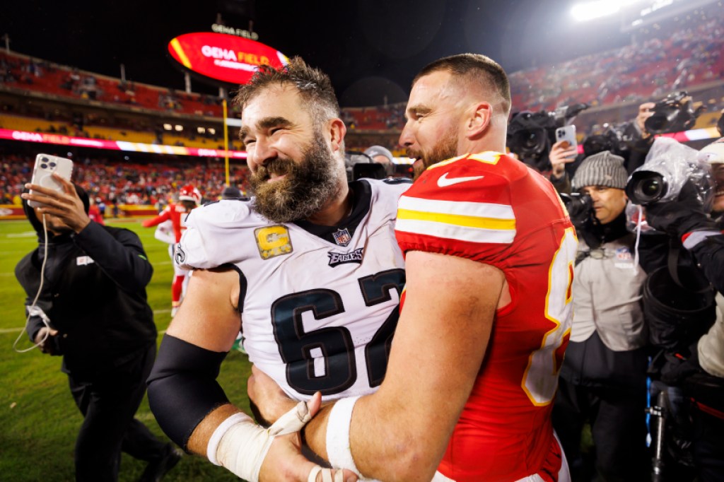  Jason Kelce #62 of the Philadelphia Eagles and Travis Kelce #87 of the Kansas City Chiefs embrace after an NFL football game against the Kansas City Chiefs at GEHA Field at Arrowhead Stadium on November 20, 2023 in Kansas City, Missouri. (Photo by Ryan Kang/Getty Images)