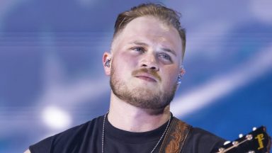  Zach Bryan performs in support of his "The Quittin Time Tour 2024" at Ford Field on June 20, 2024 in Detroit, Michigan. (Photo by Scott Legato/Getty Images)