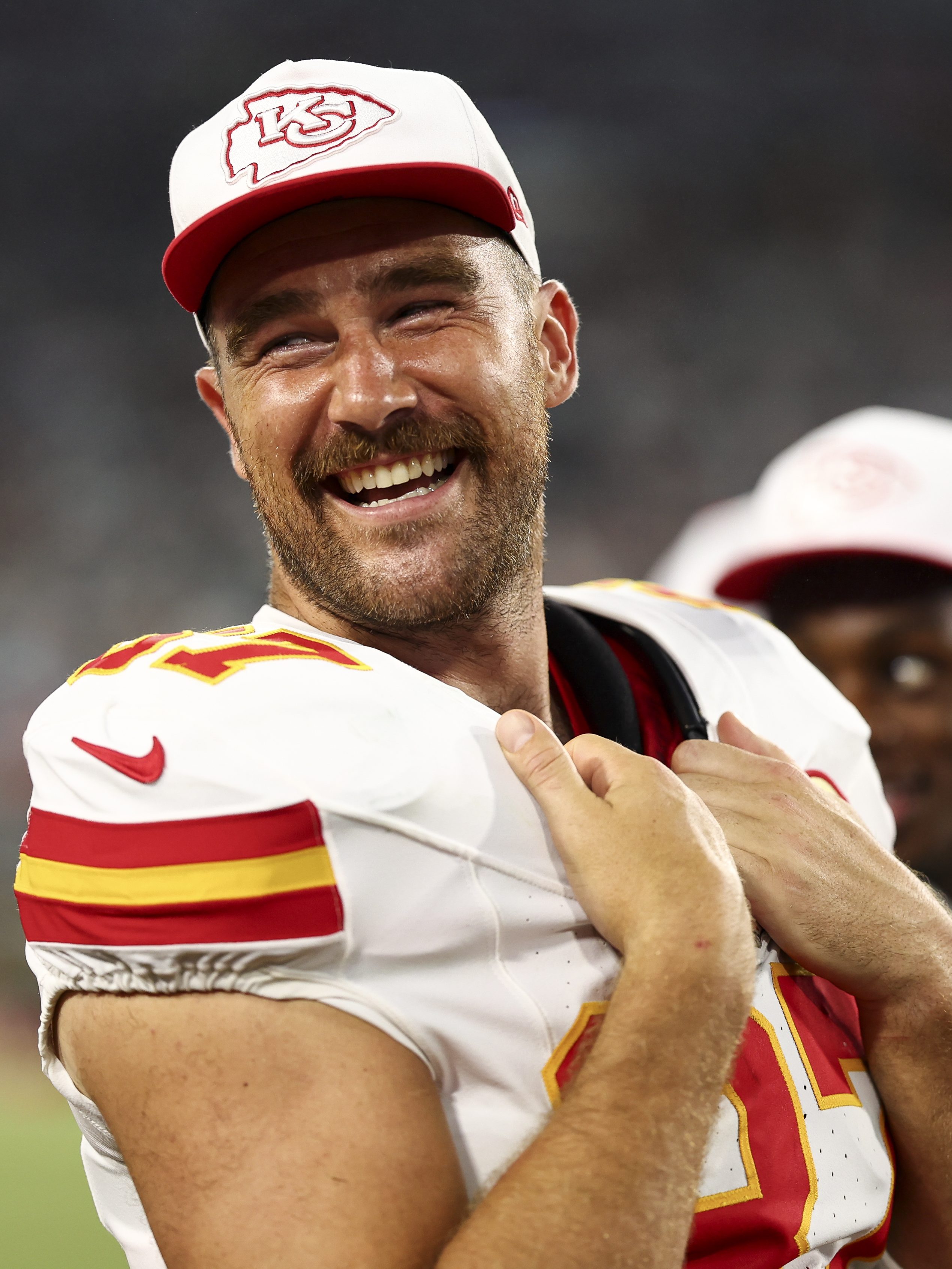 JACKSONVILLE, FL - AUGUST 10: Travis Kelce #87 of the Kansas City Chiefs smiles on the sidelines during the second quarter of an NFL preseason football game against the Jacksonville Jaguars at EverBank Stadium on August 10, 2024 in Jacksonville, Florida. (Photo by Kevin Sabitus/Getty Images)