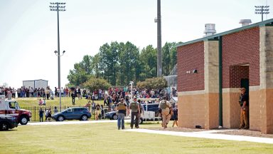  Students wait to be picked up by their parents after a shooting at Apalachee High School on September 4, 2024 in Winder, Georgia. Multiple fatalities and injuries have been reported and a suspect is in custody according to authorities. (Photo by Megan Varner/Getty Images)