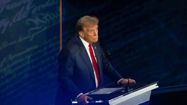 PHILADELPHIA, PA  September 10: Former President and Republican presidential candidate Donald Trump reacts as Vice President and Democratic presidential candidate Kamala Harris speaks during the first presidential debate at National Constitution Center in Philadelphia, PA on Tuesday, Sept. 10, 2024. ABC News hosted the first presidential debate between Vice President and Democratic presidential candidate Kamala Harris and Former President and Republican presidential candidate Donald Trump during the 2024 general election.  (Photo by Demetrius Freeman/The Washington Post via Getty Images)