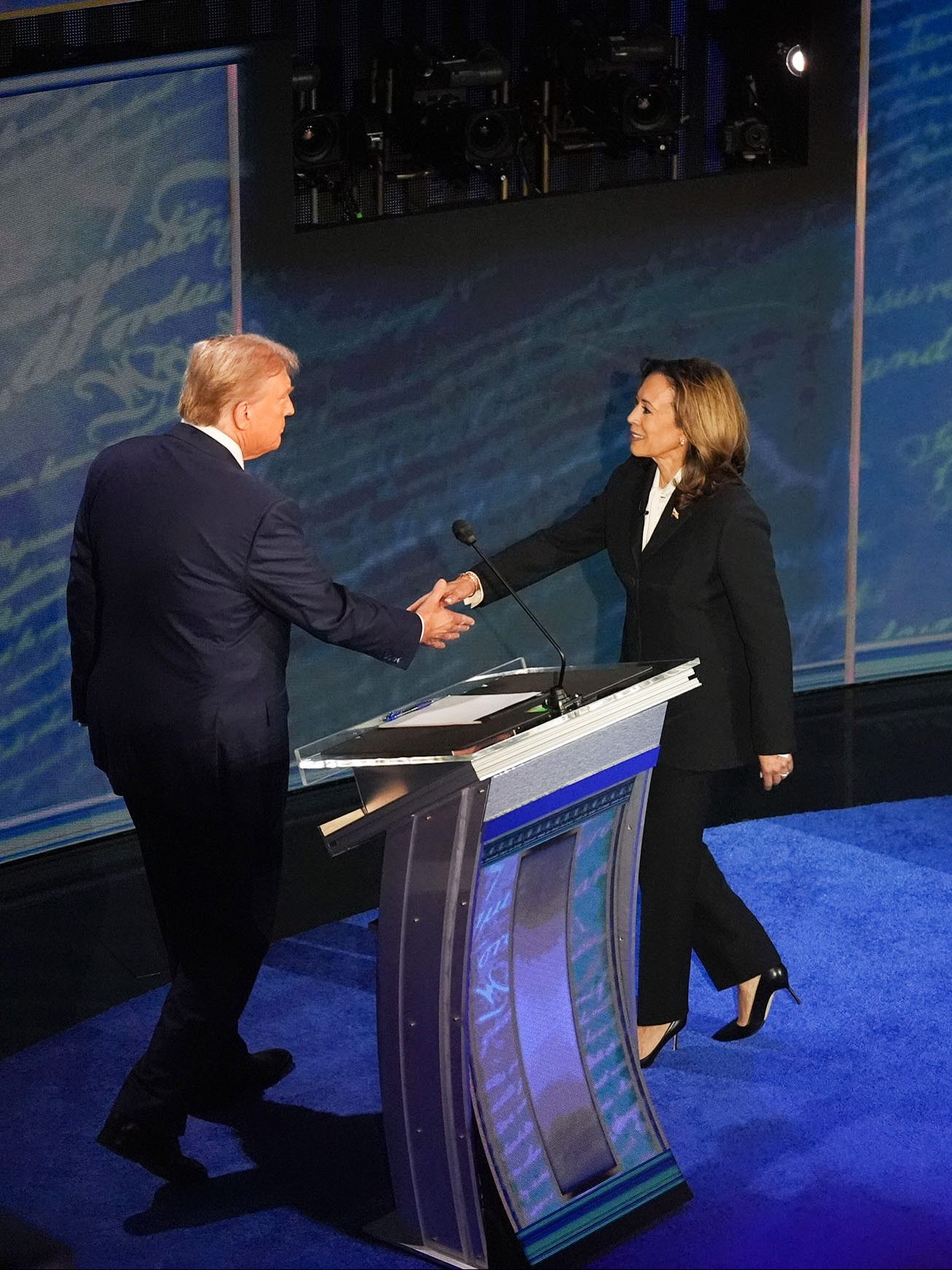PHILADELPHIA, PA  September 10: Vice President and Democratic presidential candidate Kamala Harris and former President and Republican presidential candidate Donald Trump shake hands ahead of the  presidential debate at National Constitution Center in Philadelphia, PA on Tuesday, Sept. 10, 2024. ABC News hosted the first presidential debate between Vice President and Democratic presidential candidate Kamala Harris and Trump during the 2024 general election. 
(Photo by Demetrius Freeman/The Washington Post via Getty Images)