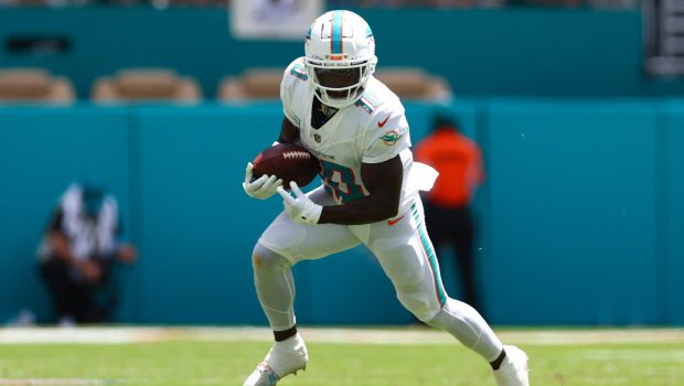 MIAMI GARDENS, FLORIDA - SEPTEMBER 08: Tyreek Hill #10 of the Miami Dolphins carries the ball against the Jacksonville Jaguars during the first quarter of the game at Hard Rock Stadium on September 08, 2024 in Miami Gardens, Florida. (Photo by Megan Briggs/Getty Images)