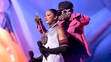  (L-R) Jordan Chiles and Flavor Flav speak on stage during the 2024 MTV Video Music Awards at UBS Arena on September 11, 2024 in Elmont, New York.  (Photo by Noam Galai/Getty Images for MTV)