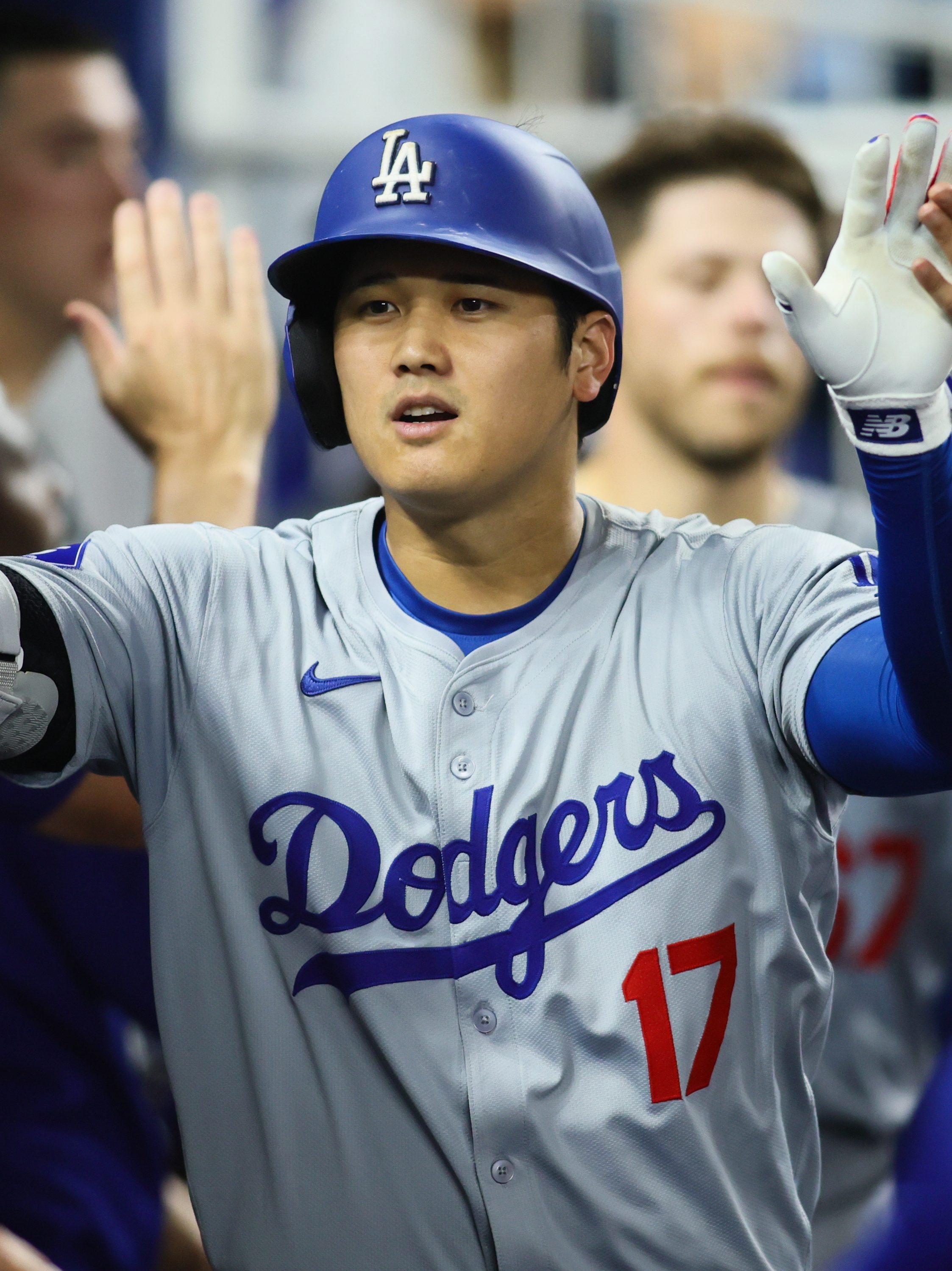 MIAMI, FLORIDA - SEPTEMBER 17: Shohei Ohtani #17 of the Los Angeles Dodgers celebrates with teammates after hitting a two-run home run against the Miami Marlins during the third inning at loanDepot park on September 17, 2024 in Miami, Florida. (Photo by Sam Navarro/Getty Images)